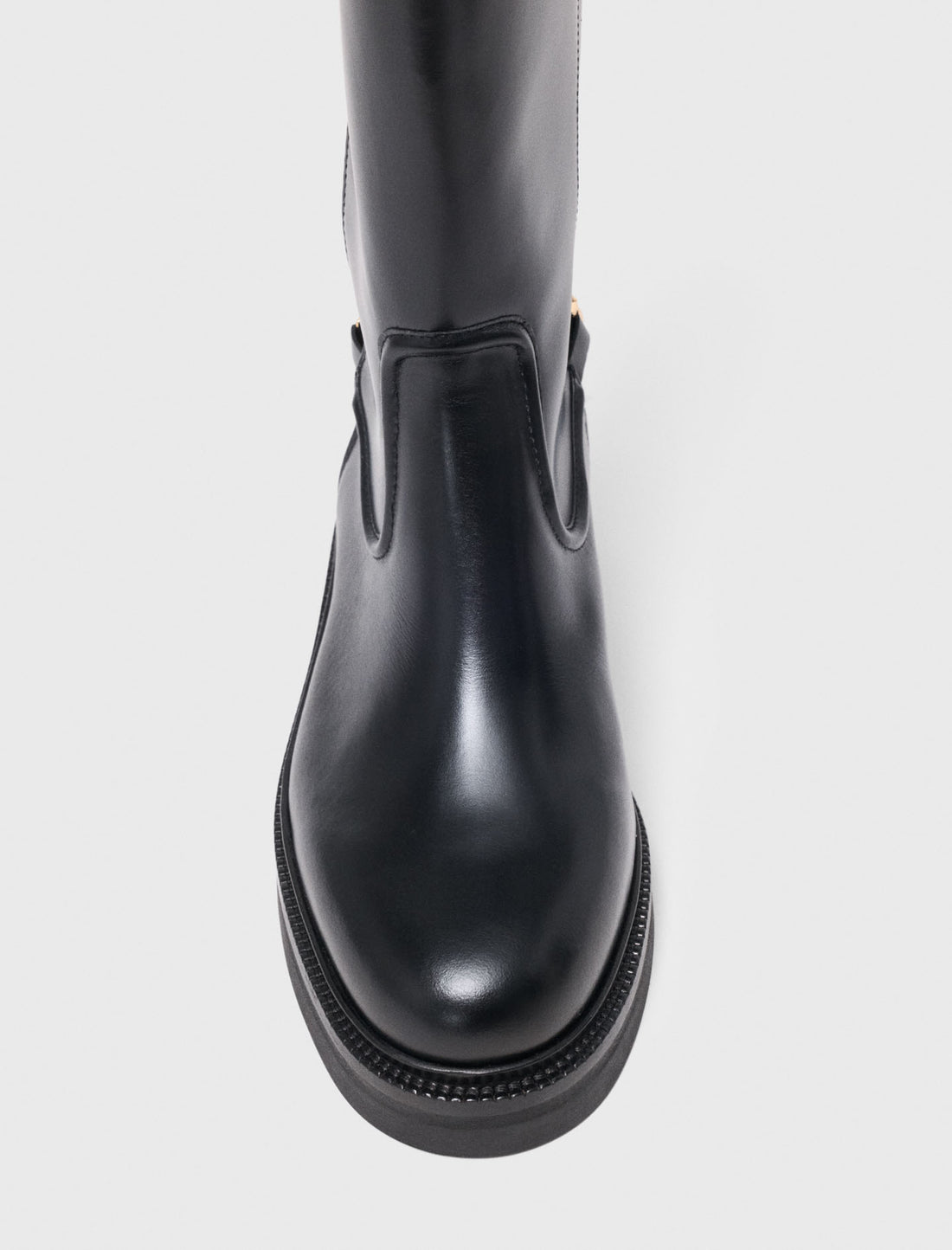 Botas planas de piel con cadena