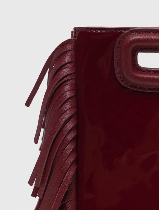 Bolso M mini de cuero liso y charol