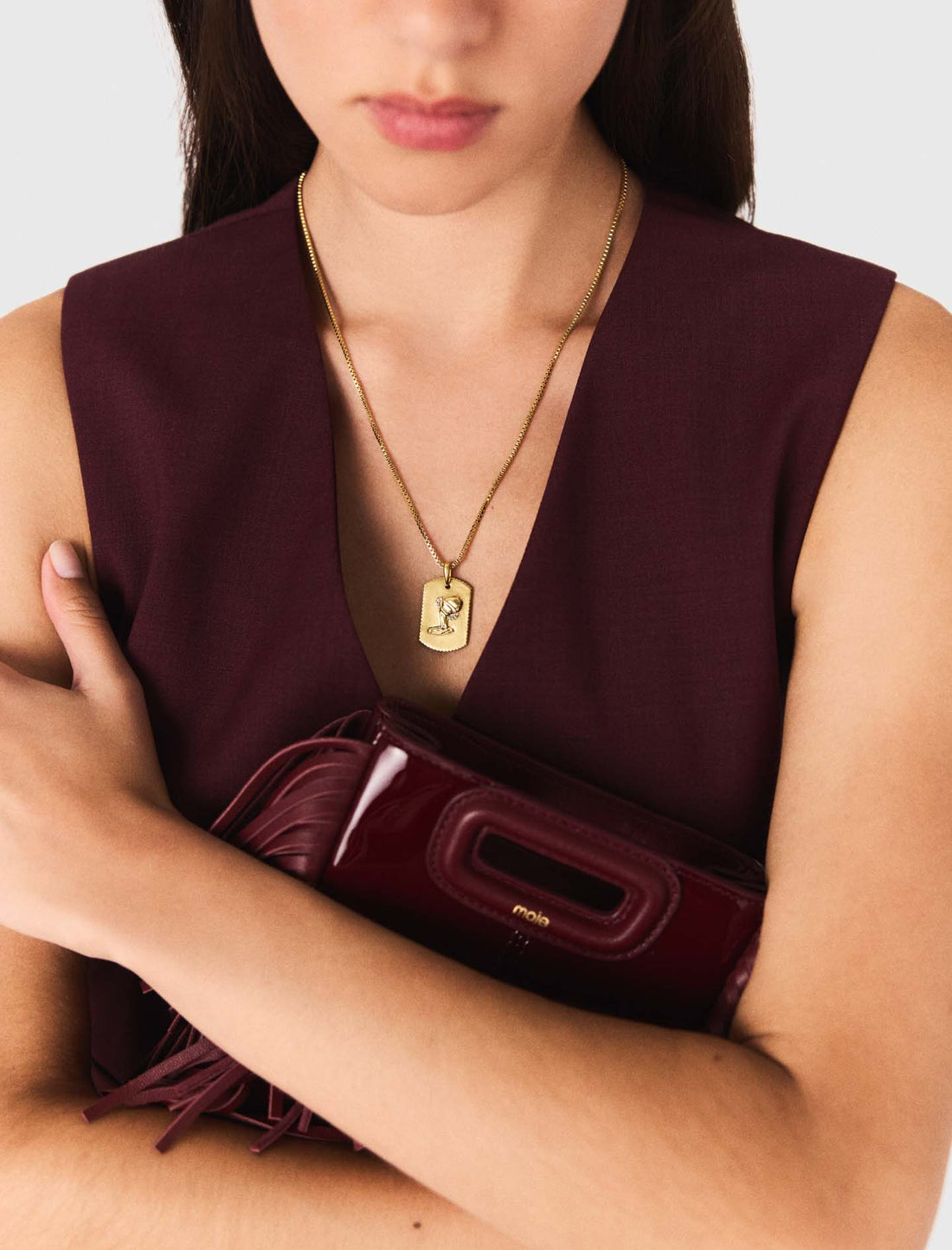 Bolso M mini de cuero liso y charol