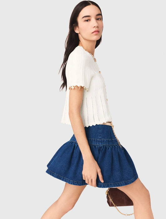 Cárdigan con joyas doradas