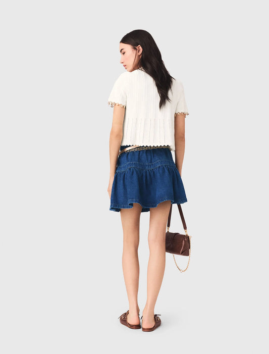 Cárdigan con joyas doradas