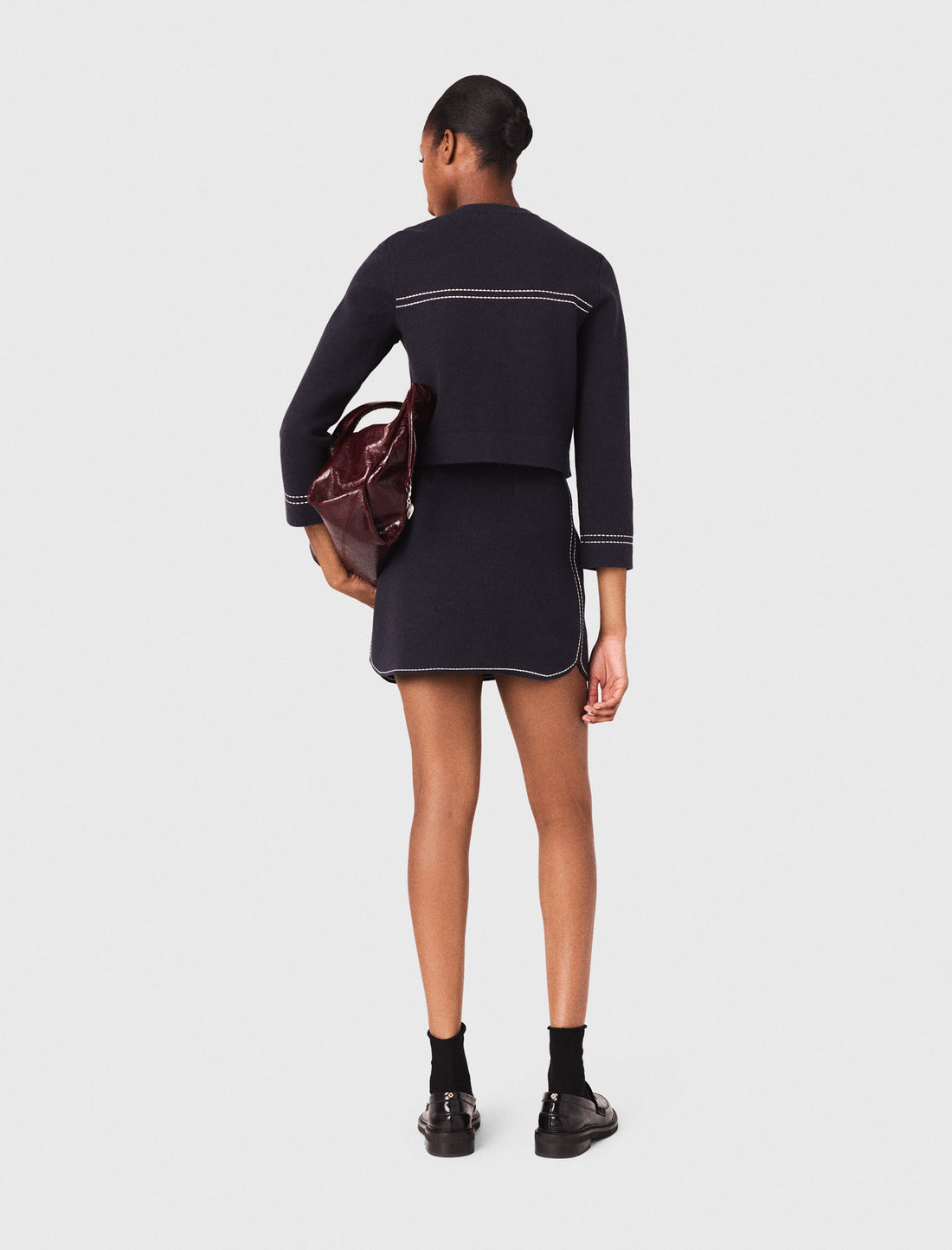 Falda corta de punto pespunteada