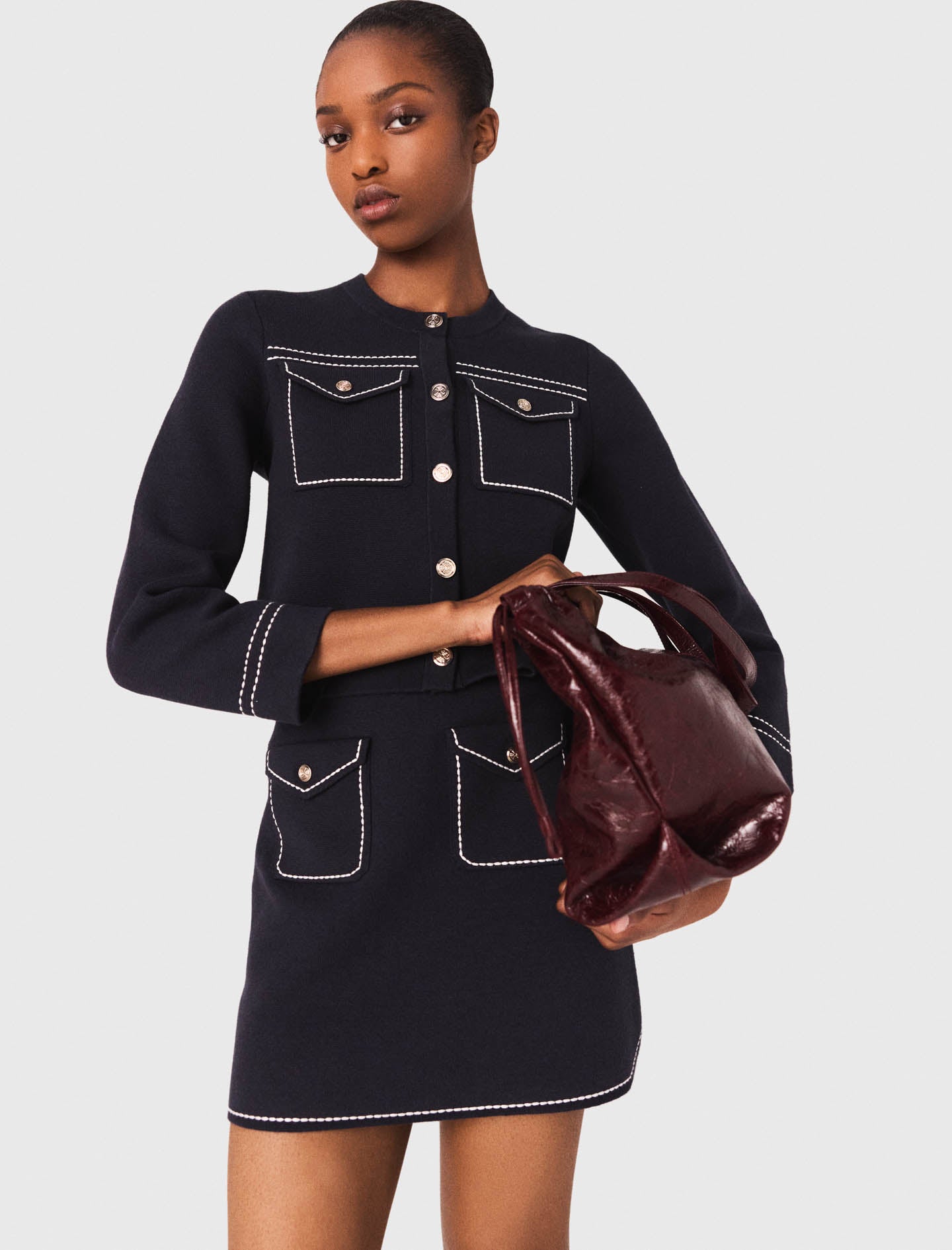 Falda corta de punto pespunteada