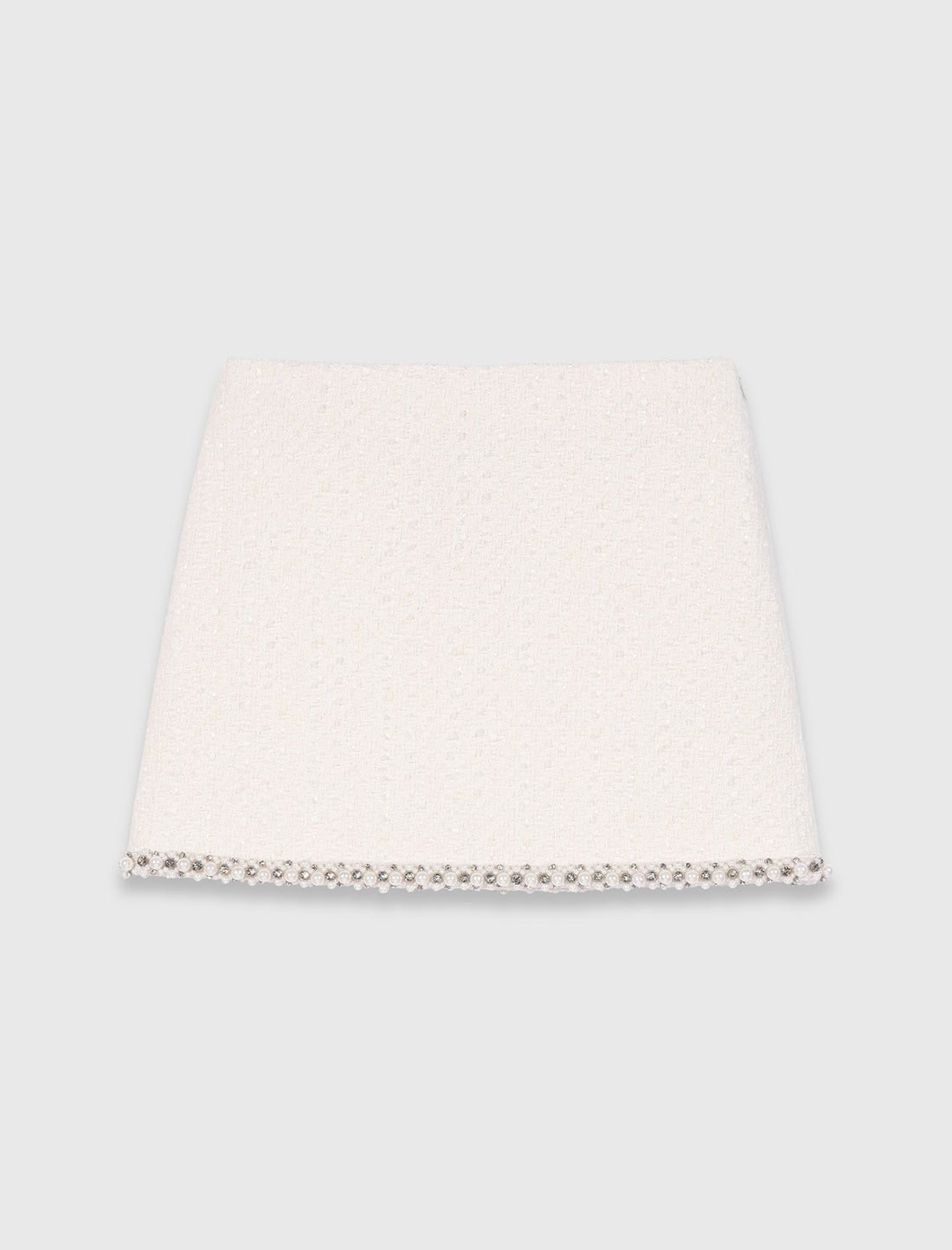 Falda de tweed con galón de perlas