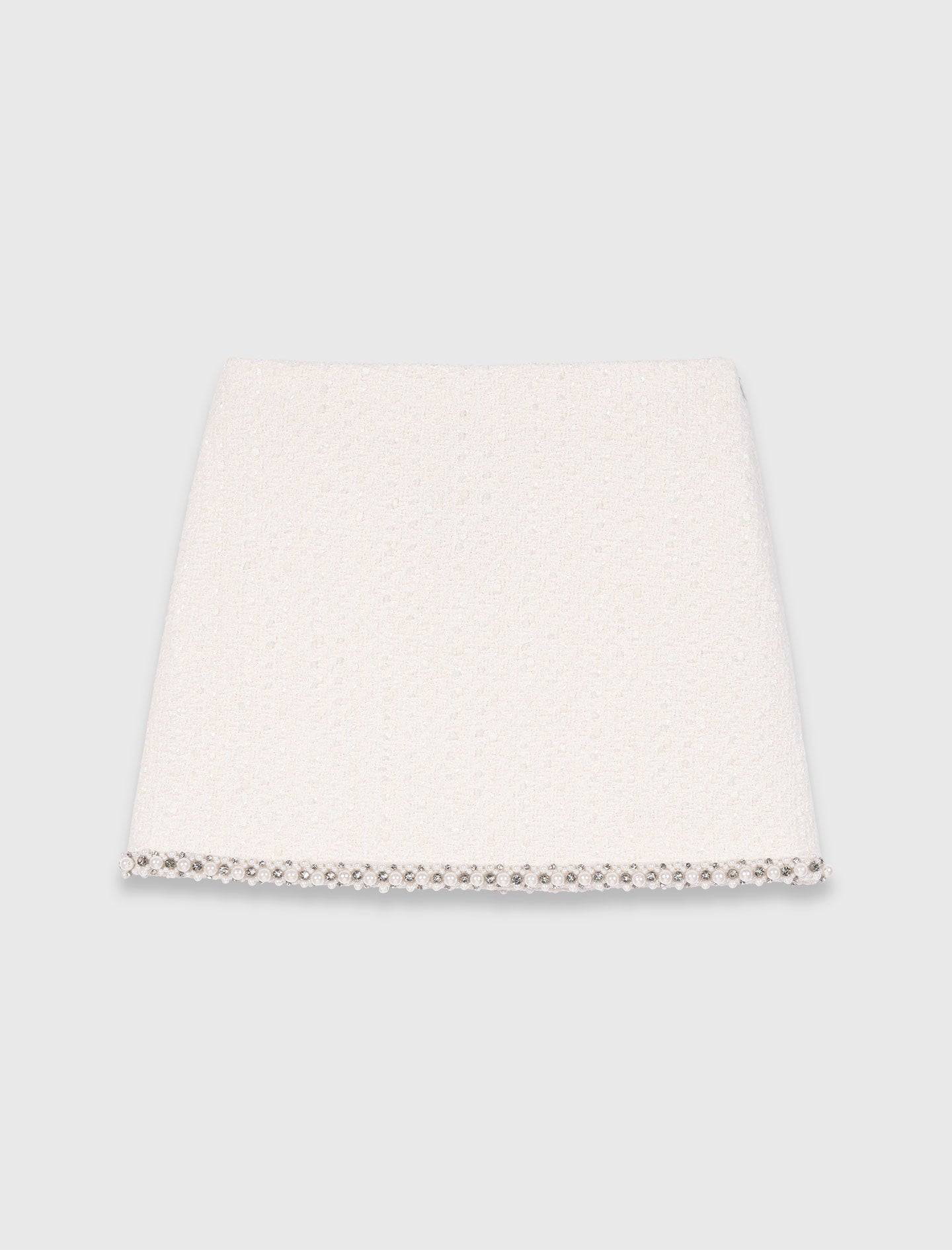 Falda de tweed con galón de perlas