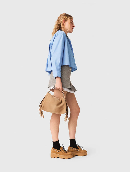 Falda plisada y detalle de popelina