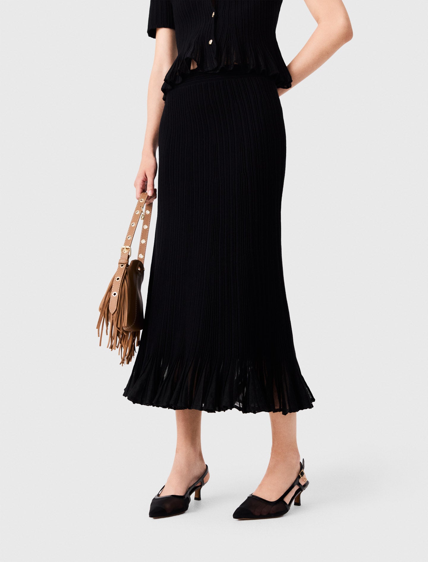 Falda de punto con bajo peplum