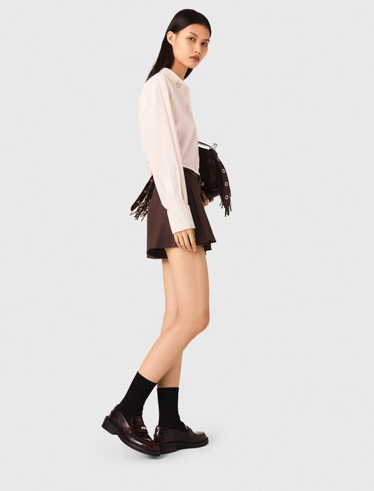 Pantalón corto trampantojo plisado