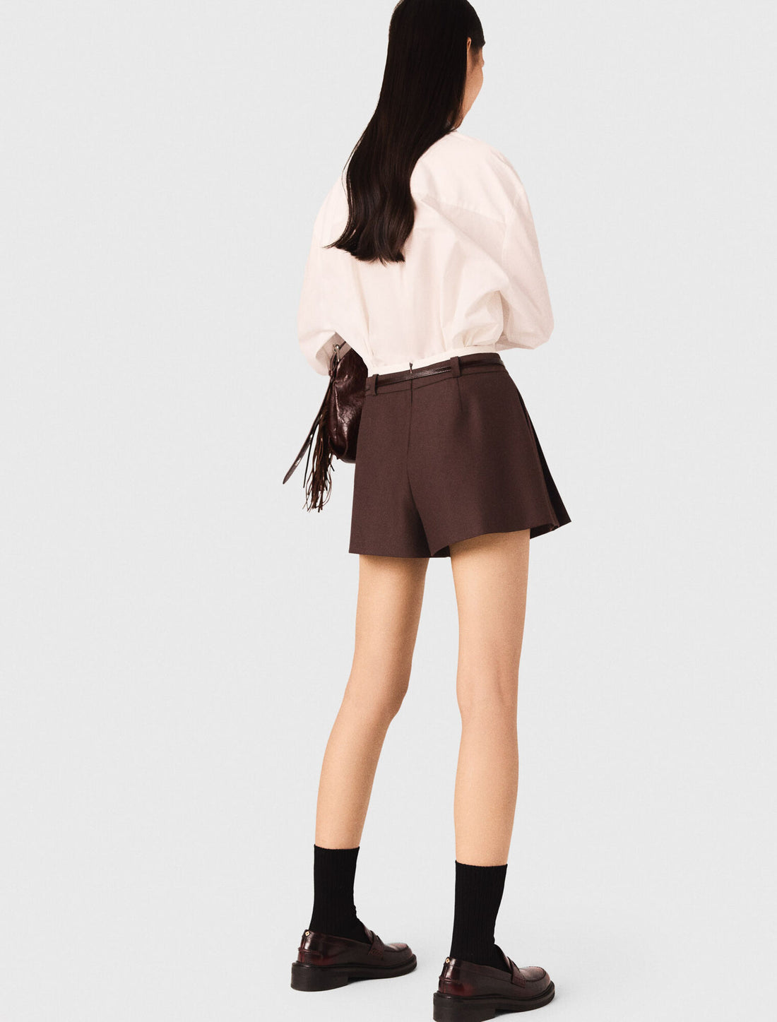 Pantalón corto trampantojo plisado