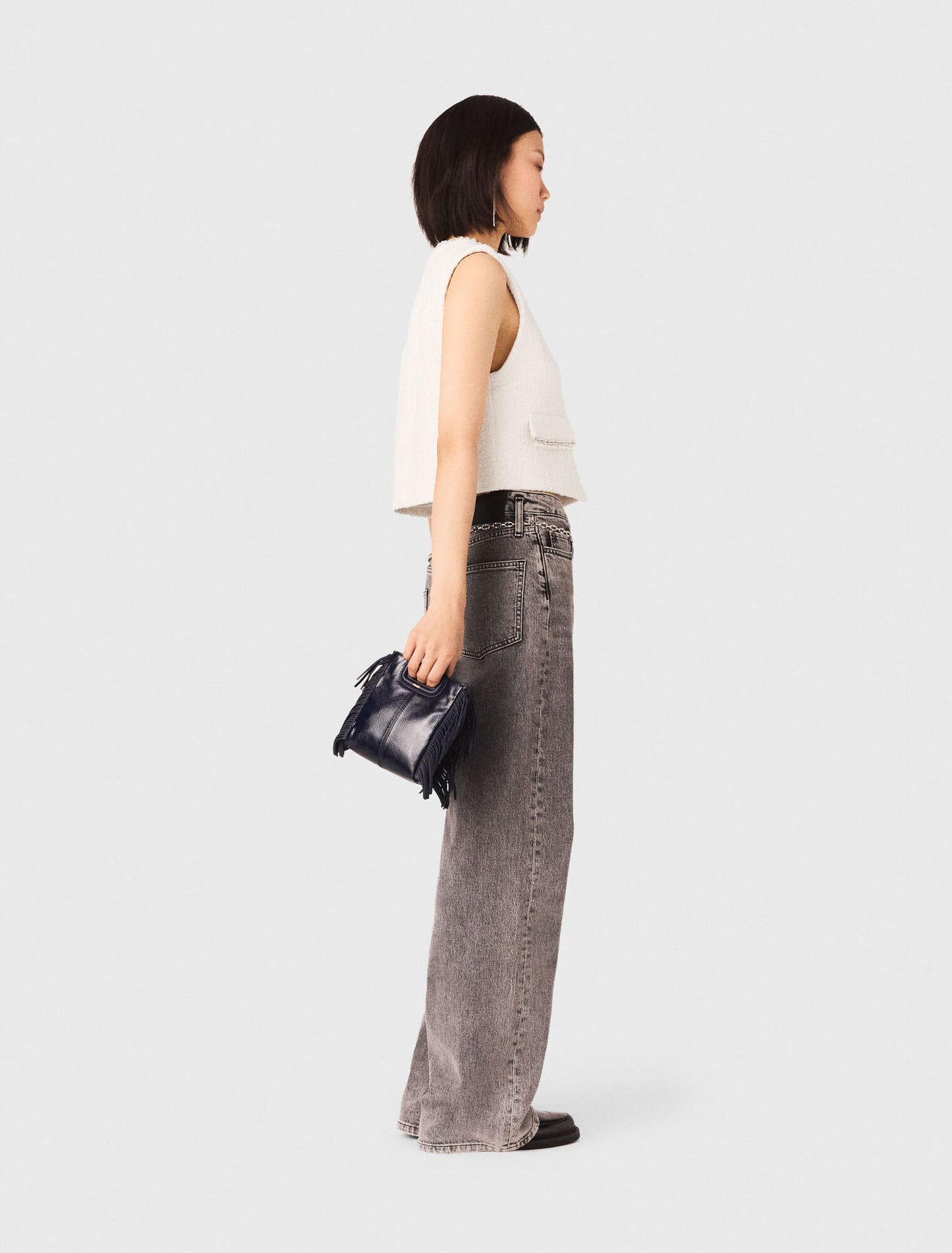 Chaleco de tweed y galón de perlas