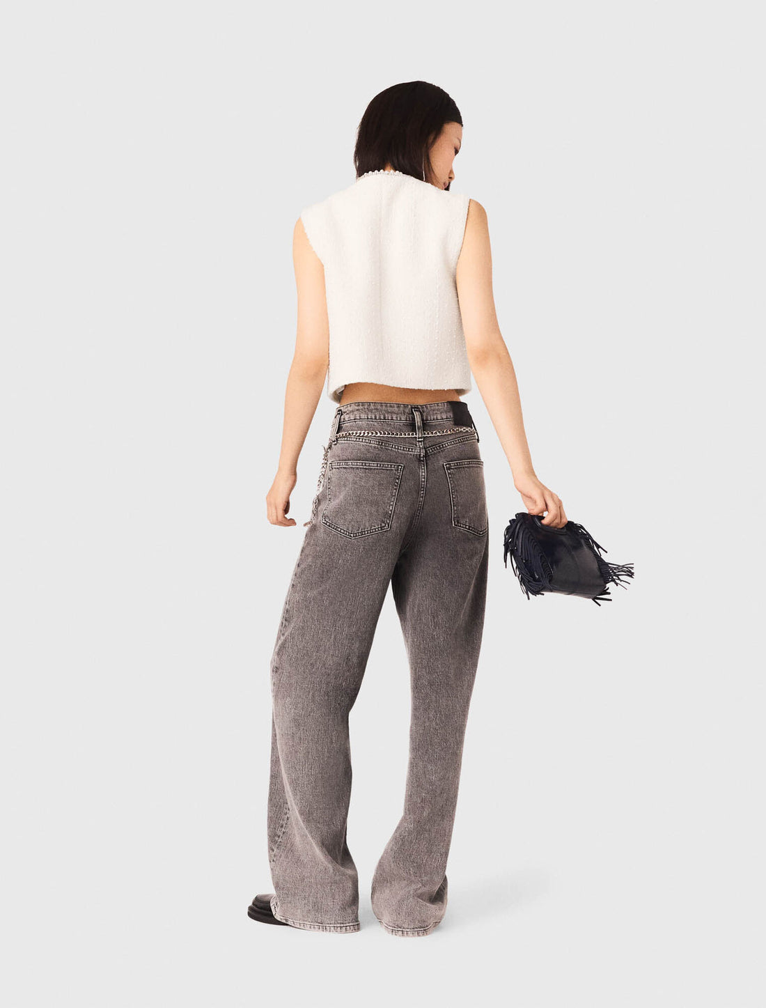 Chaleco de tweed y galón de perlas