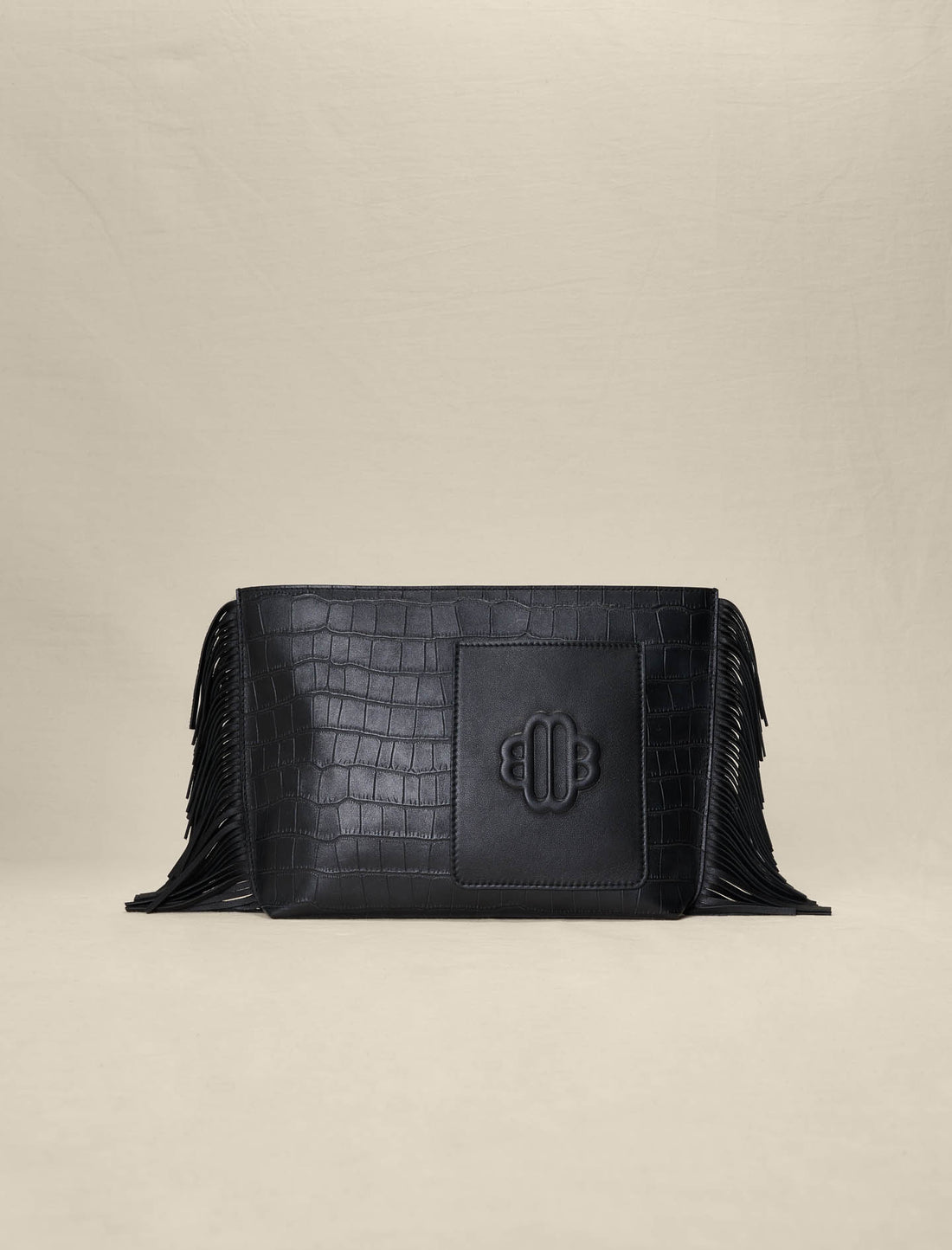 Pouch con flecos en piel grabada