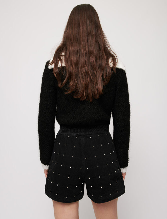 Short vaquero acolchado con tachuelas