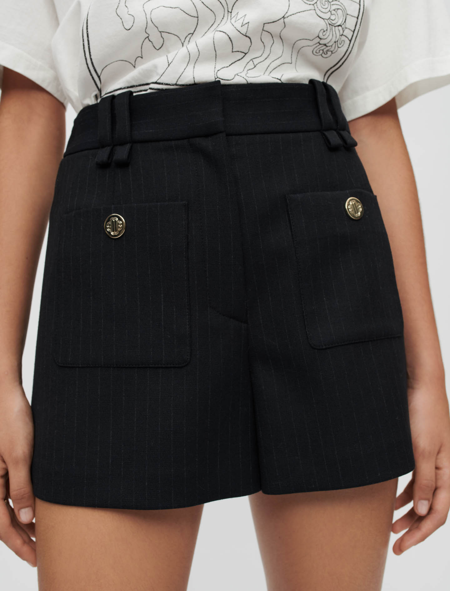 Short rayas estilo tenis detalles metal